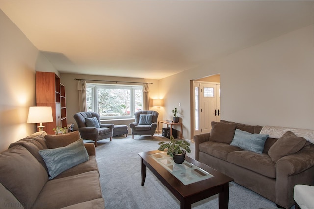 living room featuring light carpet