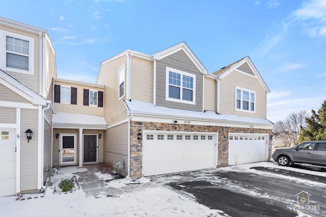 townhome / multi-family property featuring a garage