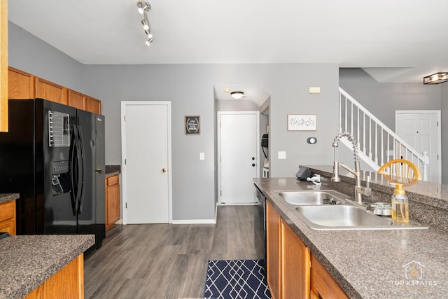 kitchen with sink, black refrigerator with ice dispenser, and dark hardwood / wood-style floors