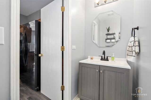 bathroom featuring vanity and hardwood / wood-style floors