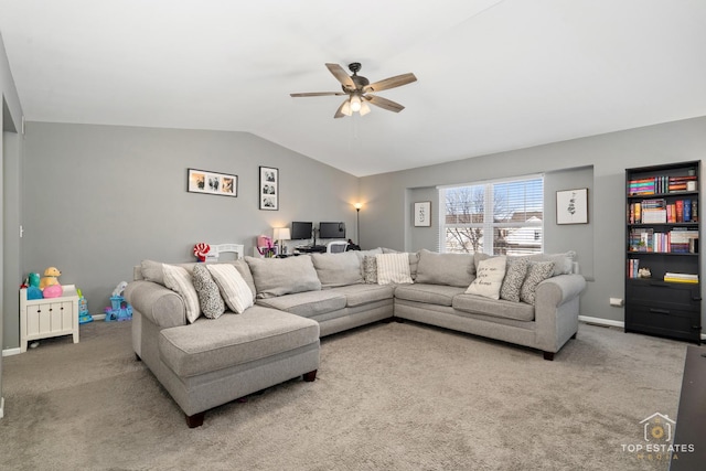 living room featuring lofted ceiling, ceiling fan, and carpet flooring