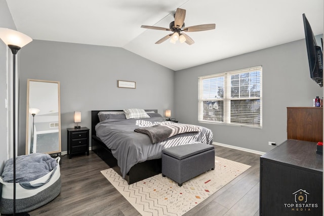 bedroom featuring dark wood-type flooring, ceiling fan, and lofted ceiling