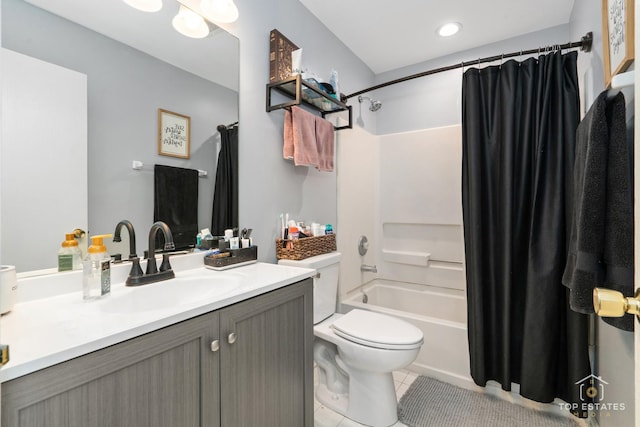 full bathroom featuring shower / bath combination with curtain, vanity, tile patterned floors, and toilet