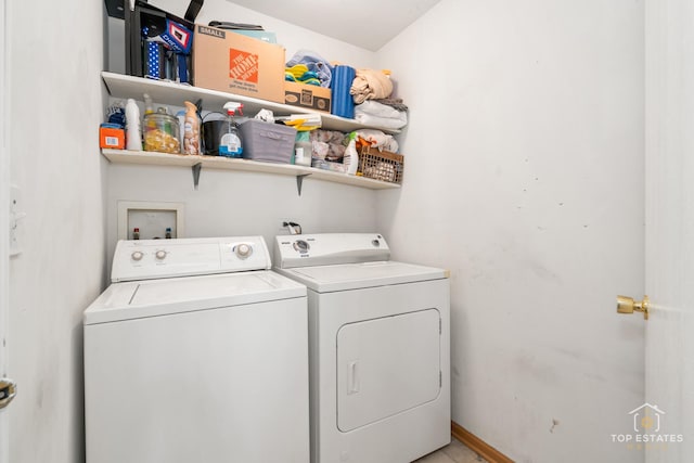 clothes washing area featuring washing machine and dryer