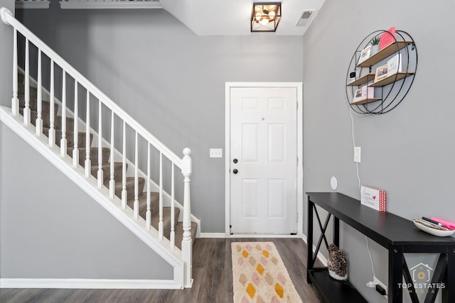 entrance foyer featuring dark hardwood / wood-style flooring