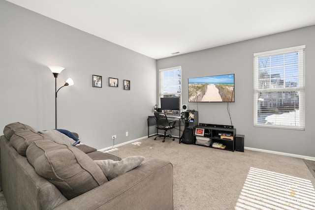 carpeted home office featuring a healthy amount of sunlight