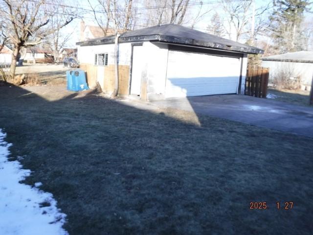 view of property exterior featuring an outbuilding and a garage