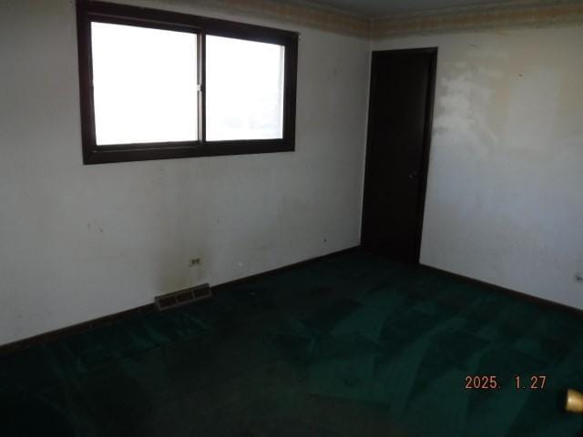 spare room featuring ornamental molding