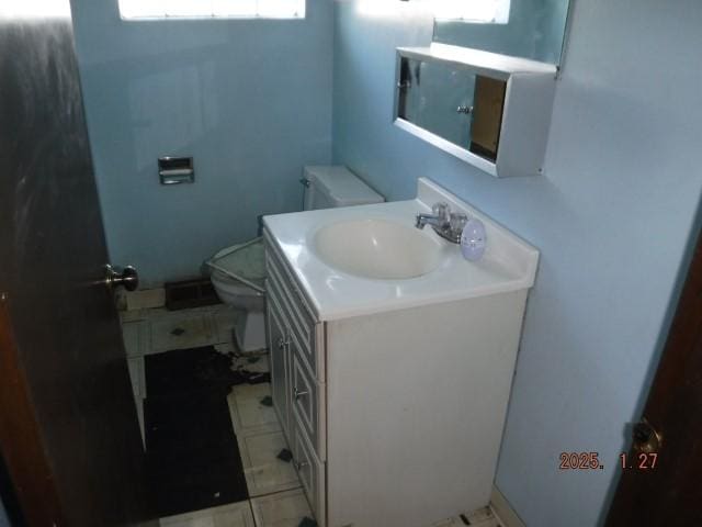 bathroom with vanity and toilet