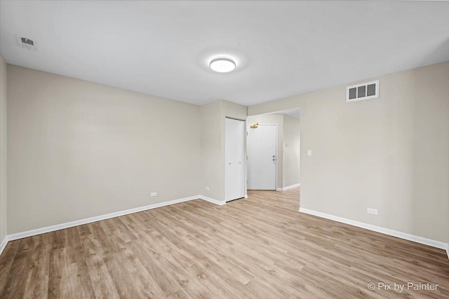 unfurnished room featuring light hardwood / wood-style flooring