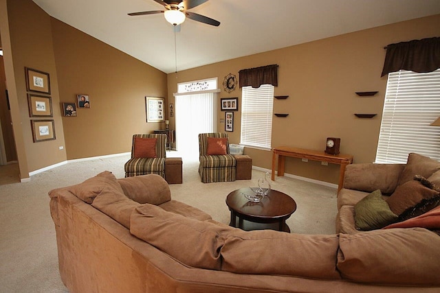 living room with ceiling fan, lofted ceiling, and light carpet