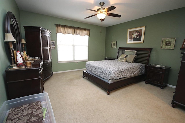 bedroom with light colored carpet and ceiling fan