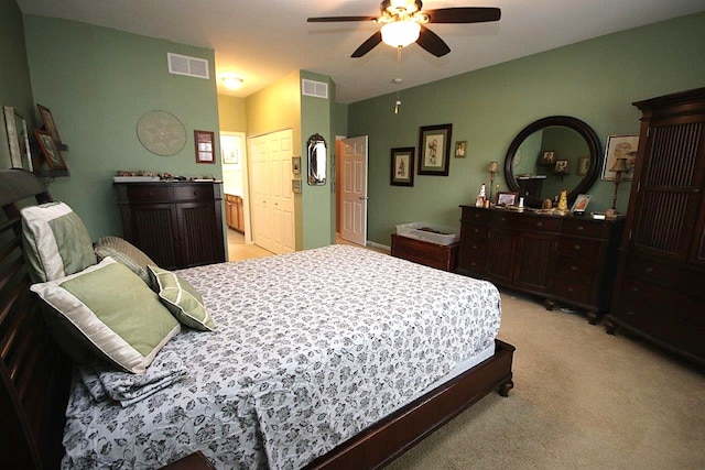 bedroom with light colored carpet and ceiling fan