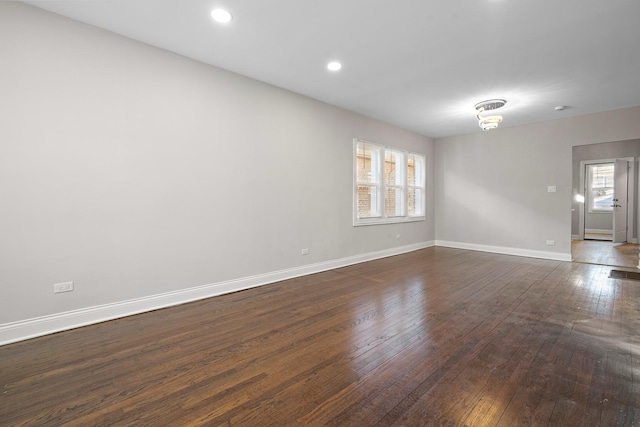 spare room featuring dark hardwood / wood-style floors