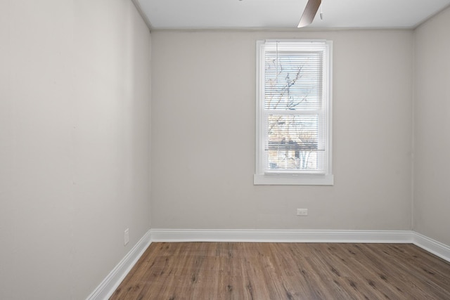 unfurnished room with hardwood / wood-style floors and ceiling fan
