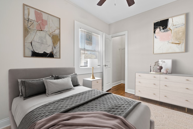 bedroom with ceiling fan and dark hardwood / wood-style flooring