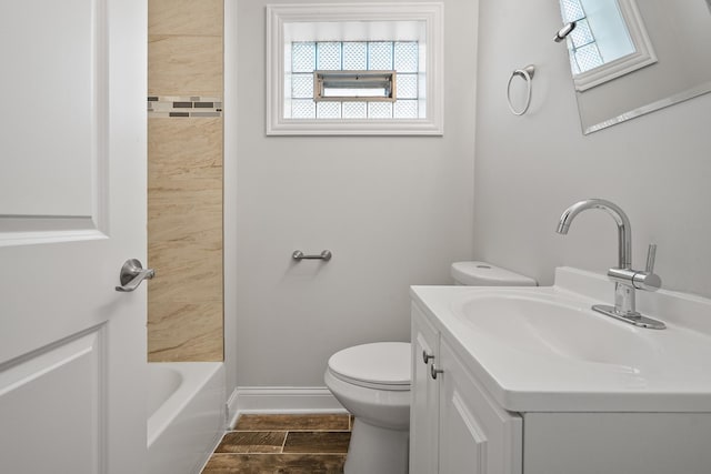 bathroom featuring vanity, a wealth of natural light, and toilet
