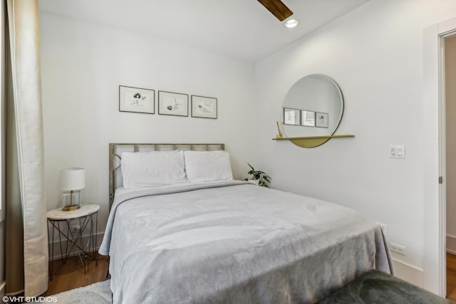 bedroom with wood-type flooring