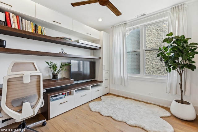 office area with ceiling fan and light hardwood / wood-style floors