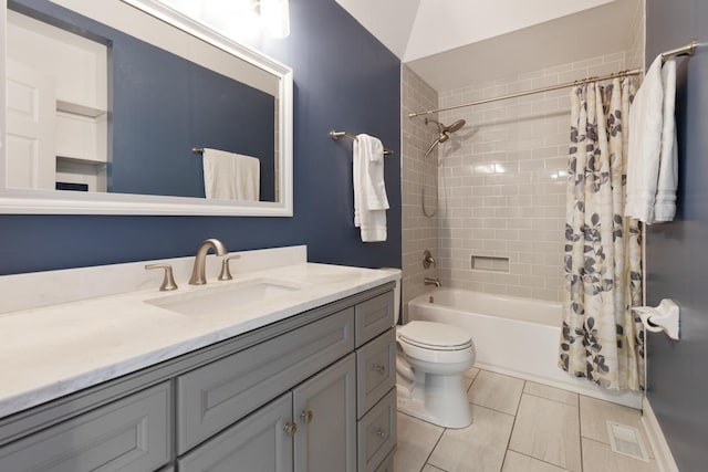 full bathroom featuring shower / tub combo with curtain, vanity, tile patterned flooring, and toilet