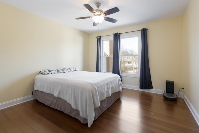 bedroom featuring dark hardwood / wood-style floors and ceiling fan