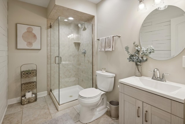 bathroom with tile patterned flooring, toilet, vanity, and a shower with shower door