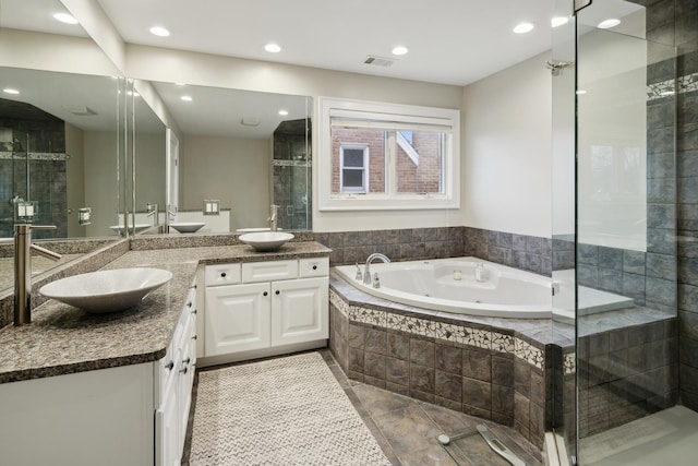 bathroom featuring vanity, tile patterned floors, and independent shower and bath