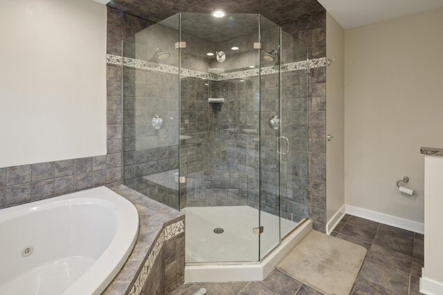 bathroom featuring plus walk in shower and tile patterned flooring