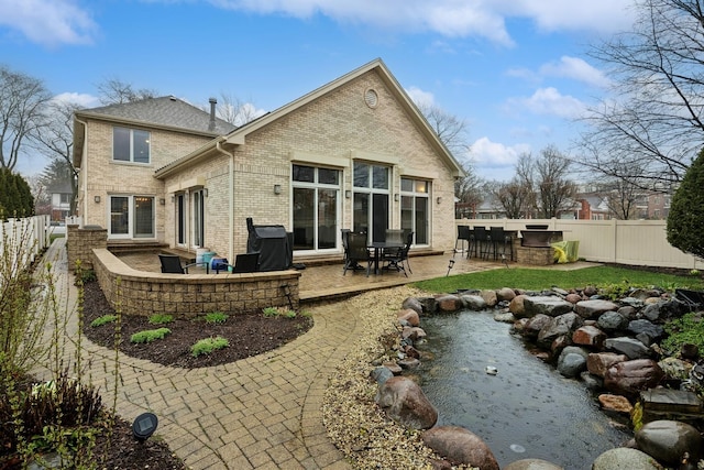 rear view of property with a patio