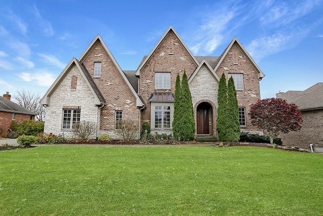 tudor-style house with a front lawn