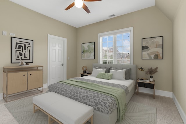 carpeted bedroom featuring lofted ceiling and ceiling fan