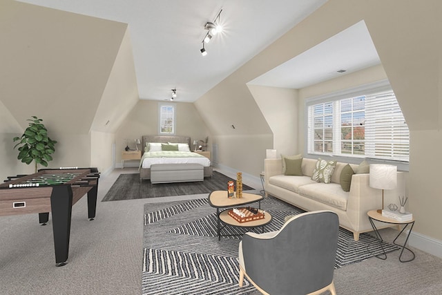 bedroom with vaulted ceiling and carpet