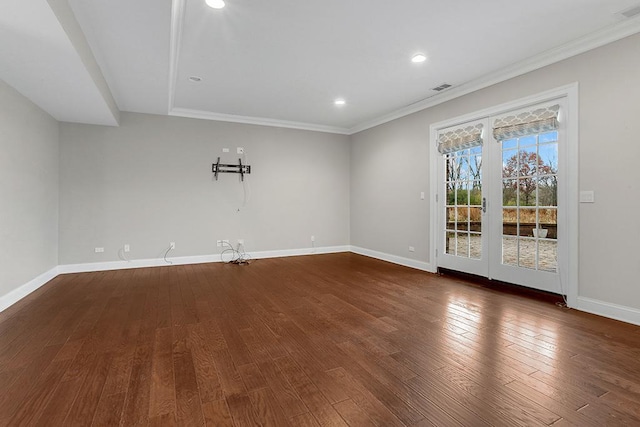 empty room featuring dark hardwood / wood-style flooring and ornamental molding