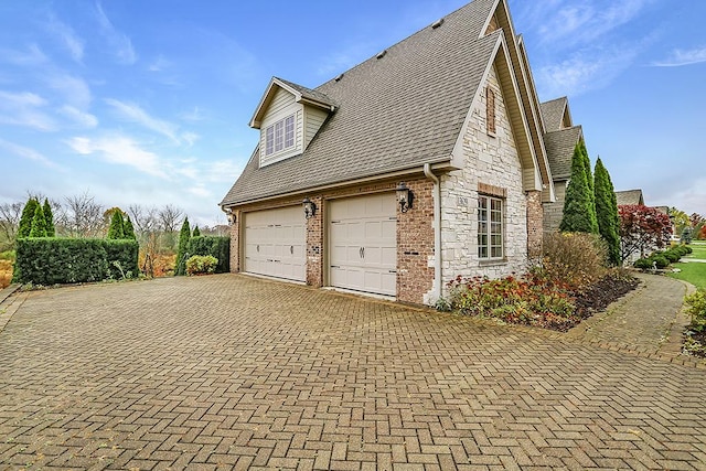 view of side of property featuring a garage