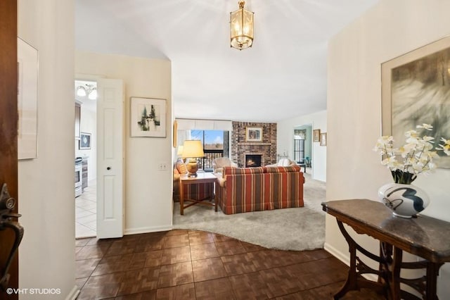 interior space featuring dark tile patterned floors and a fireplace