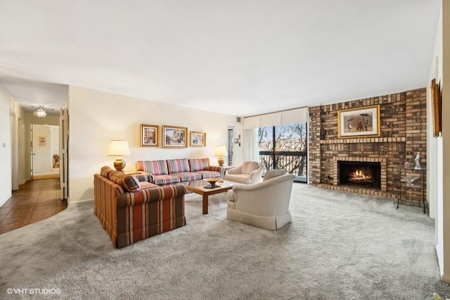 living room with carpet and a fireplace