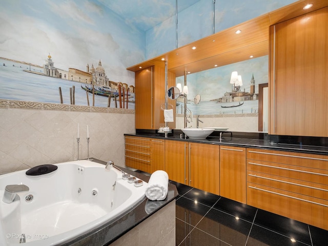 bathroom featuring a relaxing tiled tub and vanity