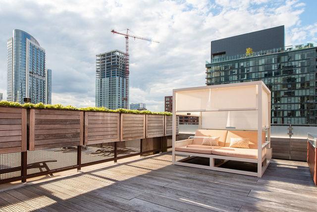 wooden terrace with an outdoor living space