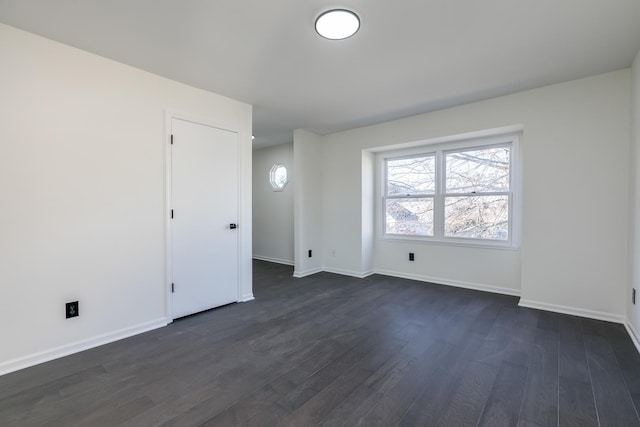 empty room featuring dark hardwood / wood-style flooring