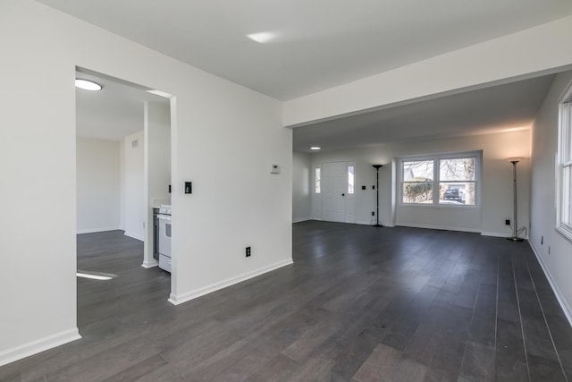 unfurnished room featuring dark wood-type flooring