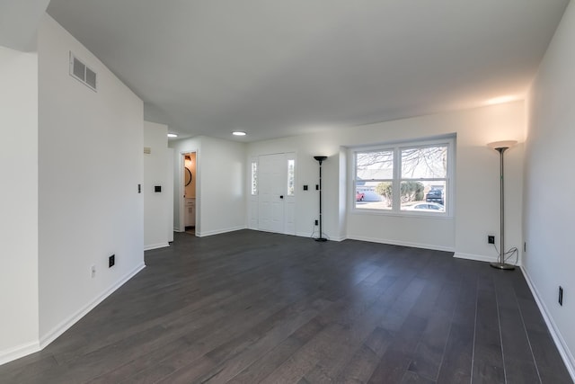 empty room with dark hardwood / wood-style flooring