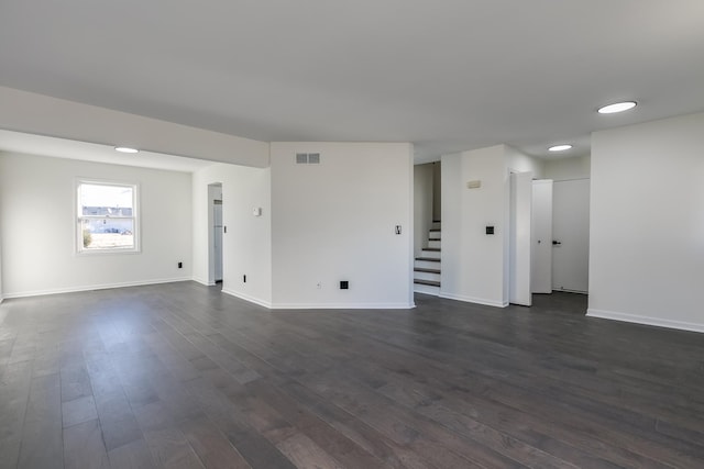 empty room featuring dark hardwood / wood-style flooring