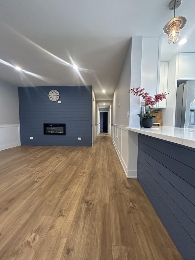 hall with light hardwood / wood-style flooring