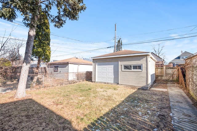 garage featuring a lawn