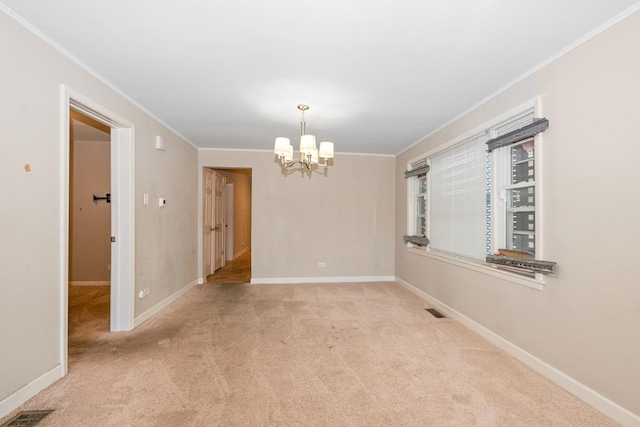 unfurnished room with light carpet, a notable chandelier, and ornamental molding