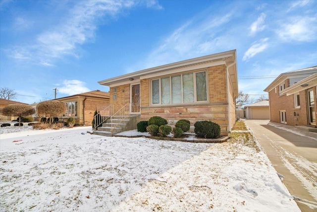 view of front of home featuring a garage and an outdoor structure