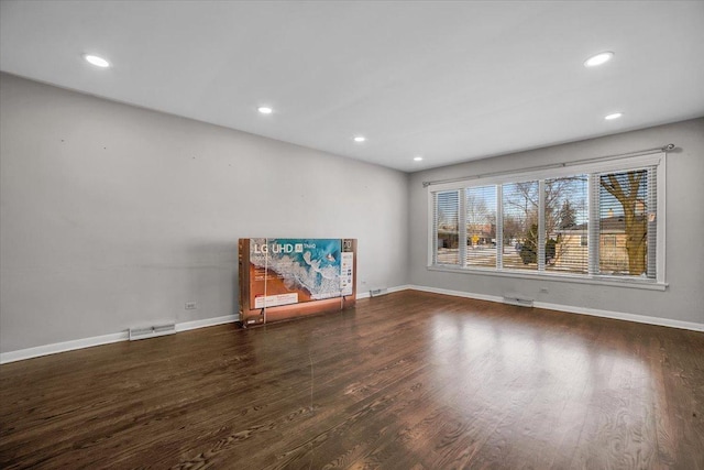 unfurnished living room featuring dark wood-type flooring