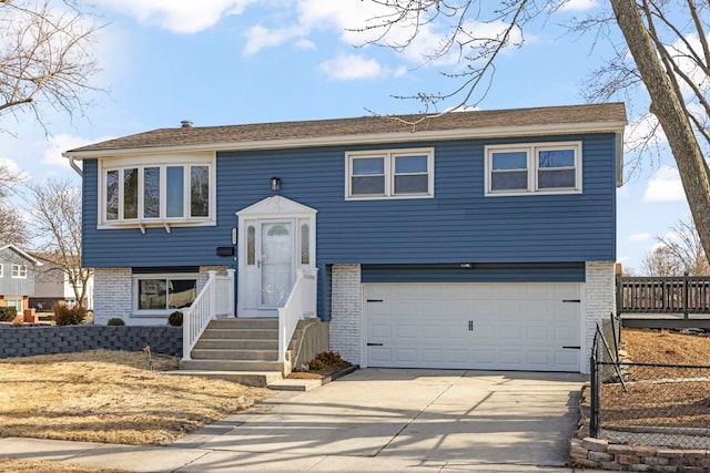 bi-level home featuring a garage