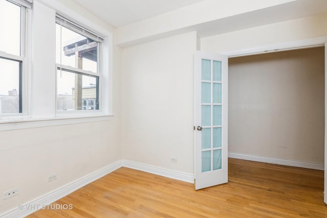 empty room featuring wood-type flooring