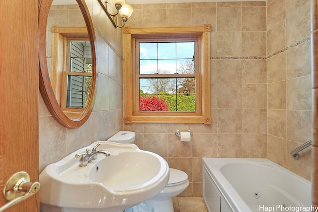 bathroom with sink, tile walls, a bathtub, tile patterned flooring, and toilet